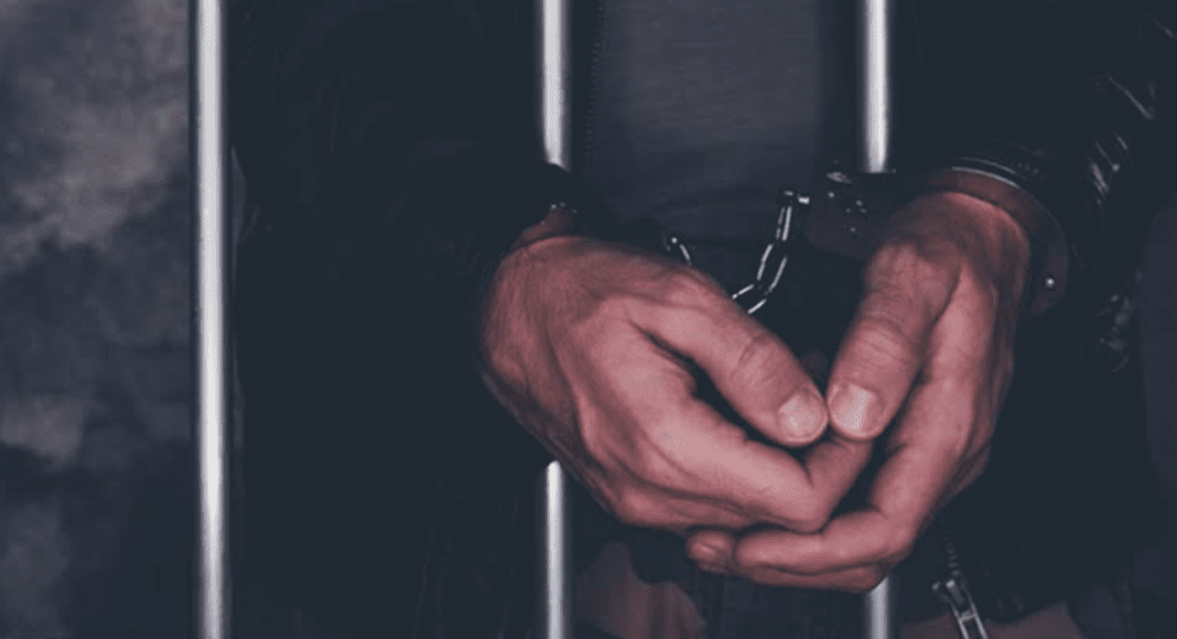 hand cuffed man